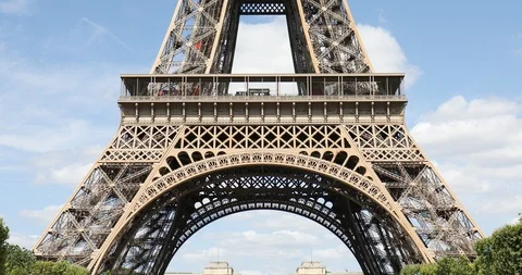 Eiffel Tower in Paris, tilt view in a sunny summer day, blue sky in France Stock Footage 124579803