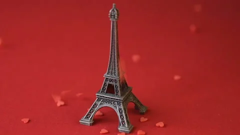 Eiffel tower red background heart confetti slow-mo Stock Footage 146750534