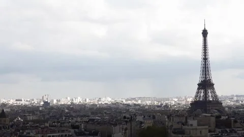 Eiffel Tower rising above Paris cityscape Stock Footage 335217861
