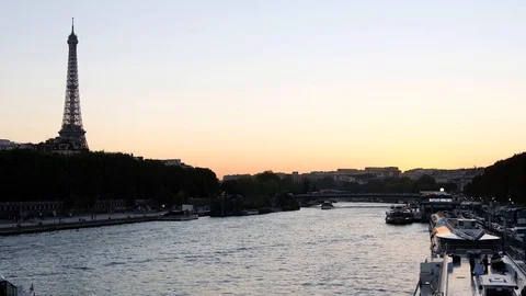 Eiffel tower with river and bridge at sunset Stock Footage 112873088