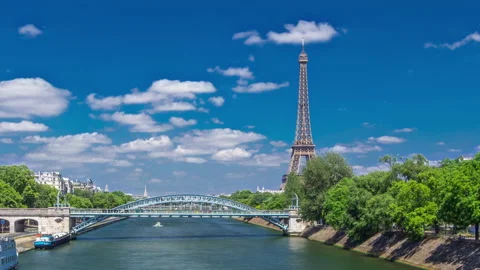 Eiffel tower at the river Seine timelapse hyperlapse from bridge in Paris Stock Footage 236492362