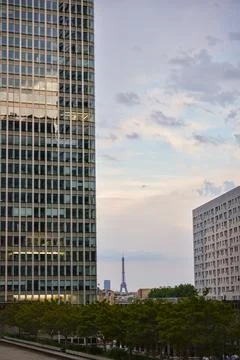 Eiffel Tower seen between buildings in La Defense Paris Stock Photos