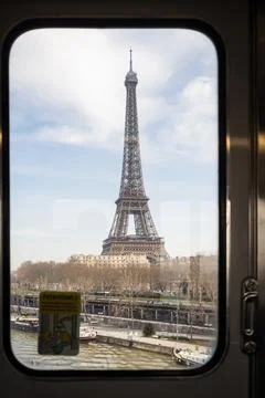 The Eiffel Tower seen from an elevated train of the Paris Metro in Paris Stock Photos
