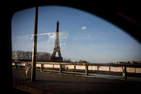 The Eiffel Tower seen through the window of a car in Paris, France. Stock Photos