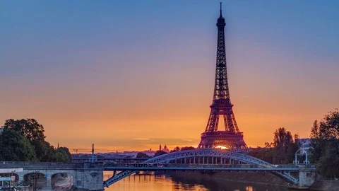 Eiffel Tower sunrise timelapse with boats on Seine river and in Paris, France. Stock Footage