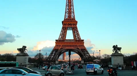 Eiffel tower on sunset, blue, dusk sky with evening car traffic Stock Footage 64123808