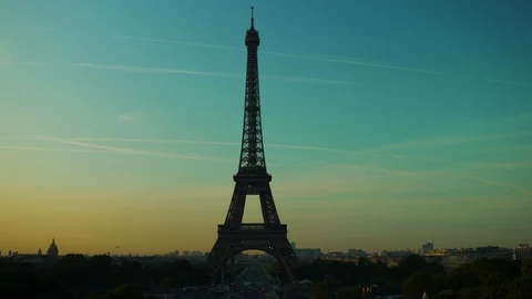 Eiffel tower at sunset orange blue sky in Paris during the summer. Haussmanian 動画素材 119357102