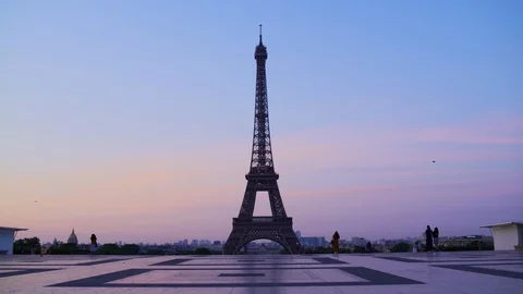 Eiffel tower at sunset orange blue sky in Paris during the summer. Haussmanian Stock Footage 119357412