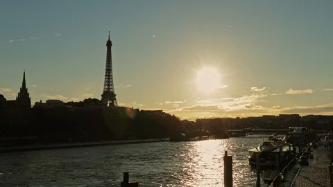 Eiffel Tower at sunset over seine river in Paris Stock Footage 128279596
