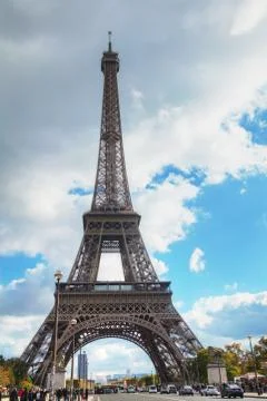 Eiffel tower surrounded by tourists Stock Photos