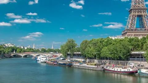 The Eiffel tower timelapse from bridge over the river Seine in Paris Stock Photos