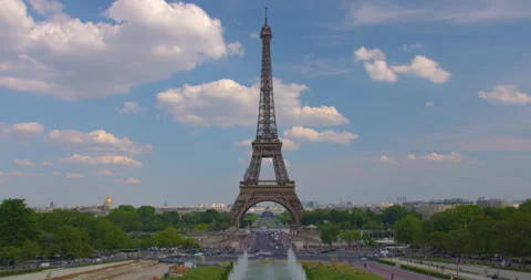 The Eiffel tower timelapse near river Seine in Paris. Ship and boats on river at Stock Footage 243838195