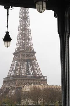 The Eiffel Tower under the Bir Hakeim bridge in the rain in Paris Stock Photos