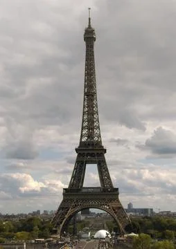 Eiffel tower under cloudy sky in Paris Stock Photos