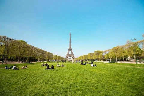 Eiffel Tower View From The Champ De Mars With The Green Grass And People Stock Photos