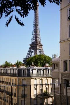 Eiffel Tower view over classic Paris rooftops Stockfoto's