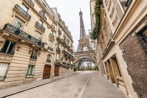 Eiffel Tower view in Paris from a small street Stock Photos