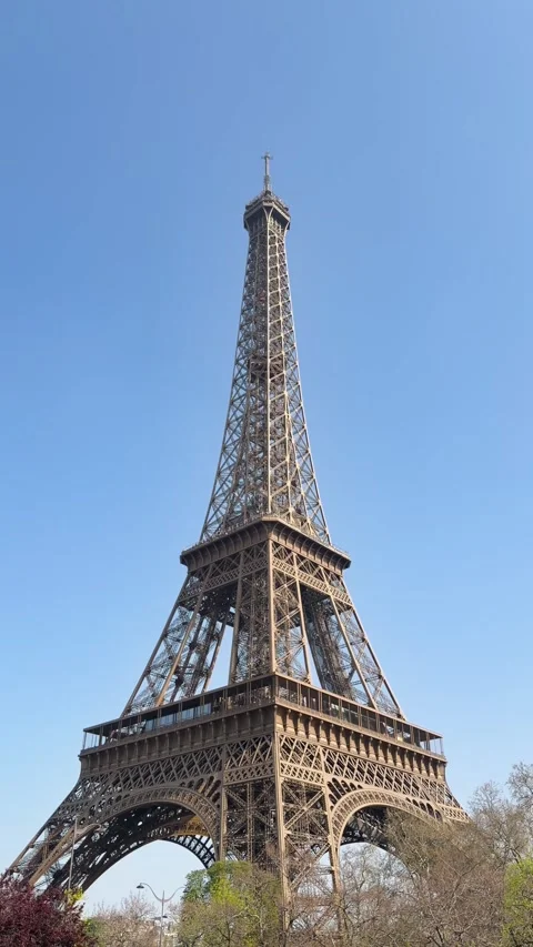 Eiffel Tower Viewed from Below Against Clear Blue Sky in Paris Daytime Vertical Stock Footage 341585867