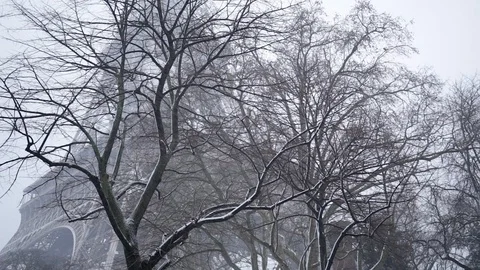 Eiffel Tower in winter with snow in Paris France on a snowy day Stock Footage 106522604