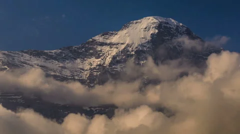 Eiger North face covered in snow and ice churning clouds time lapse Stock Footage 52219694
