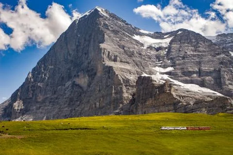 Eiger north face with train Stock Photos