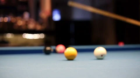 Eight-ball pool billiards player hesitates next shot Stock Footage 58453468