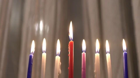 Eight candles are burning  on light curtain background. Selective focus. 4k Stock Footage 85658627