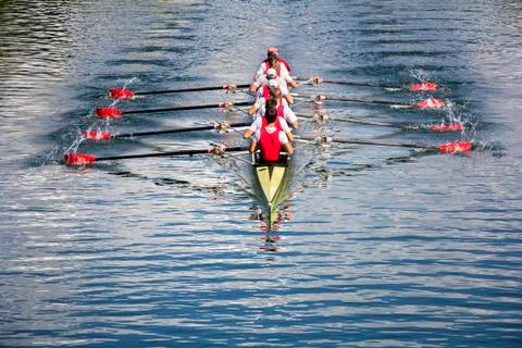 Eight men rowing Stock Photos