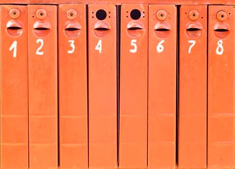 Eight old mail boxes background Stock Photos