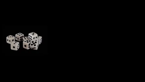 Eight white dice on a black background for the game. Bones lie on a black Stock Footage 129870847