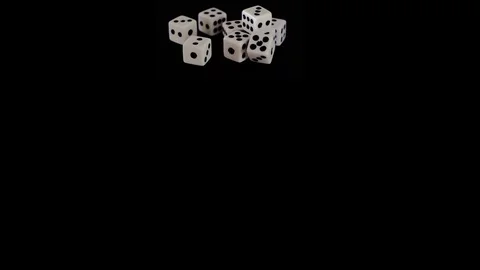Eight white dice on a black background for the game. Bones lie on a black Stock Footage 129870855