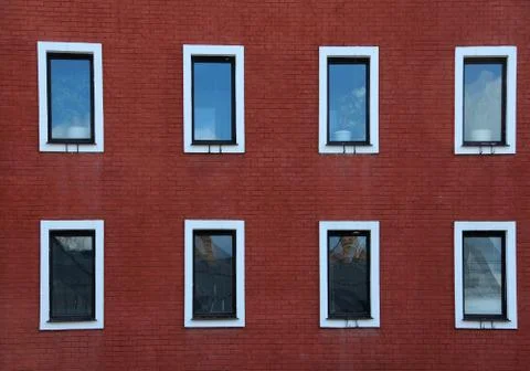 Eight Windows on Red Brick Wall Stock Photos