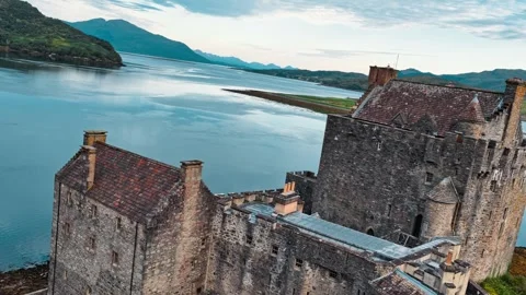 Eilean Donan Castle overlooking tranquil waters in Scotland Stock Footage 314000948