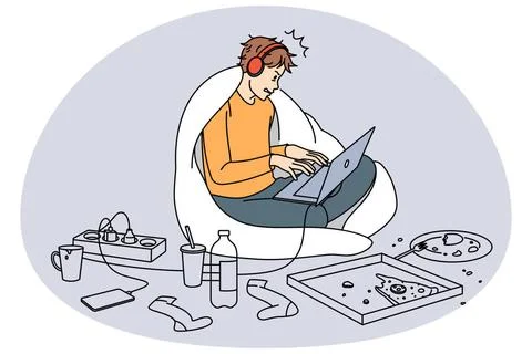 Ein Mann, der süchtig nach Gadgets ist, spielt am Laptop Ein Mann, der süc. Foto stock