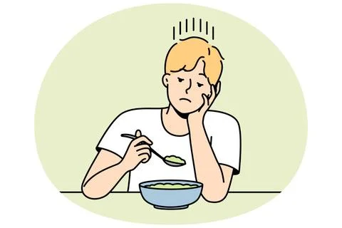 Ein Mann ohne Appetit sieht sich ein Gericht für magere Kost an. Guy witho.. 스톡 사진