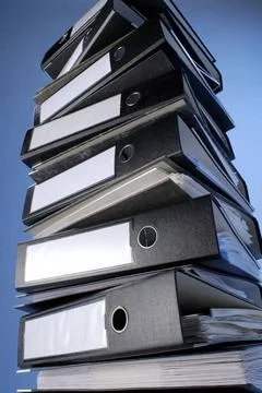 Ein Stapel Aktenordner A stack of file folders on a blue background. Copyr... Foto stock