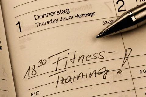 Eintrag im Kalender: Fitnesstraining Ein Termin ist in einem Kalender eing... Stock Photos