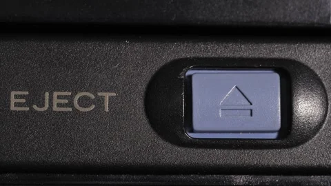 Eject Button Pressed On Camcorder With Gold Label And Blue Key Stock Footage 332600082