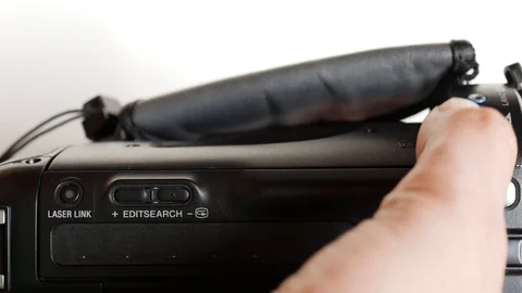Eject cassette from a camcorder, top view Stock Footage 128655749
