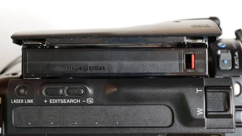 Eject cassette from a camcorder, top view Stock Footage 128655793