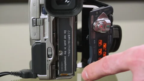 Eject a mini dv tape from camcorder Stock Video Pond5