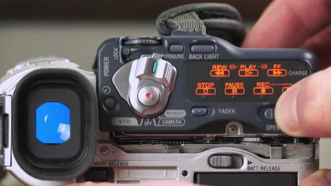 Eject a mini dv tape from video camera Stock Footage 226984019