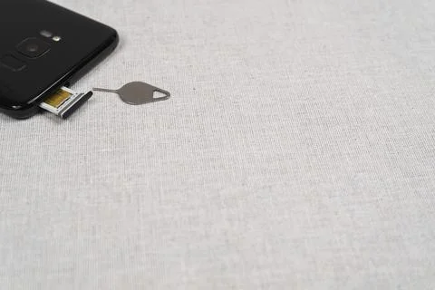 Eject tool for Sim card tray of smartphone Stock Photos