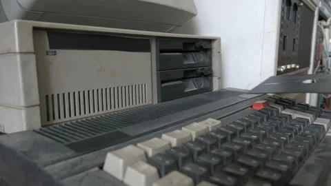 Ejecting the 5.25 Inch floppy disk from outdated computer Stock Footage 91374011