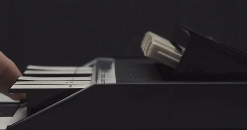 Ejecting tape and pulling it out on retro audio cassette tape player recorder Stock Footage 121188620