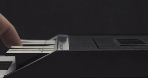 Ejecting tape and pulling it out on retro audio cassette tape player recorder 스톡 동영상 121188675