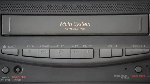 Ejecting a VHS tape from an old VCR Stock Footage 130462924
