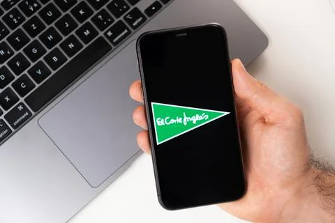 El Corte Ingles the application is open in the smartphone. The man is holding a Stock Photos
