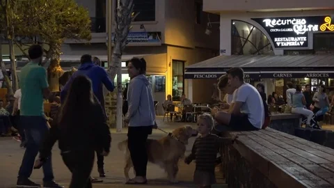 El Medano Tenerife Spain: Tourists watching ambulance arrive in holiday resort Stock Footage