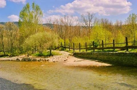 El Paular river path with spring trees Stock Photos
